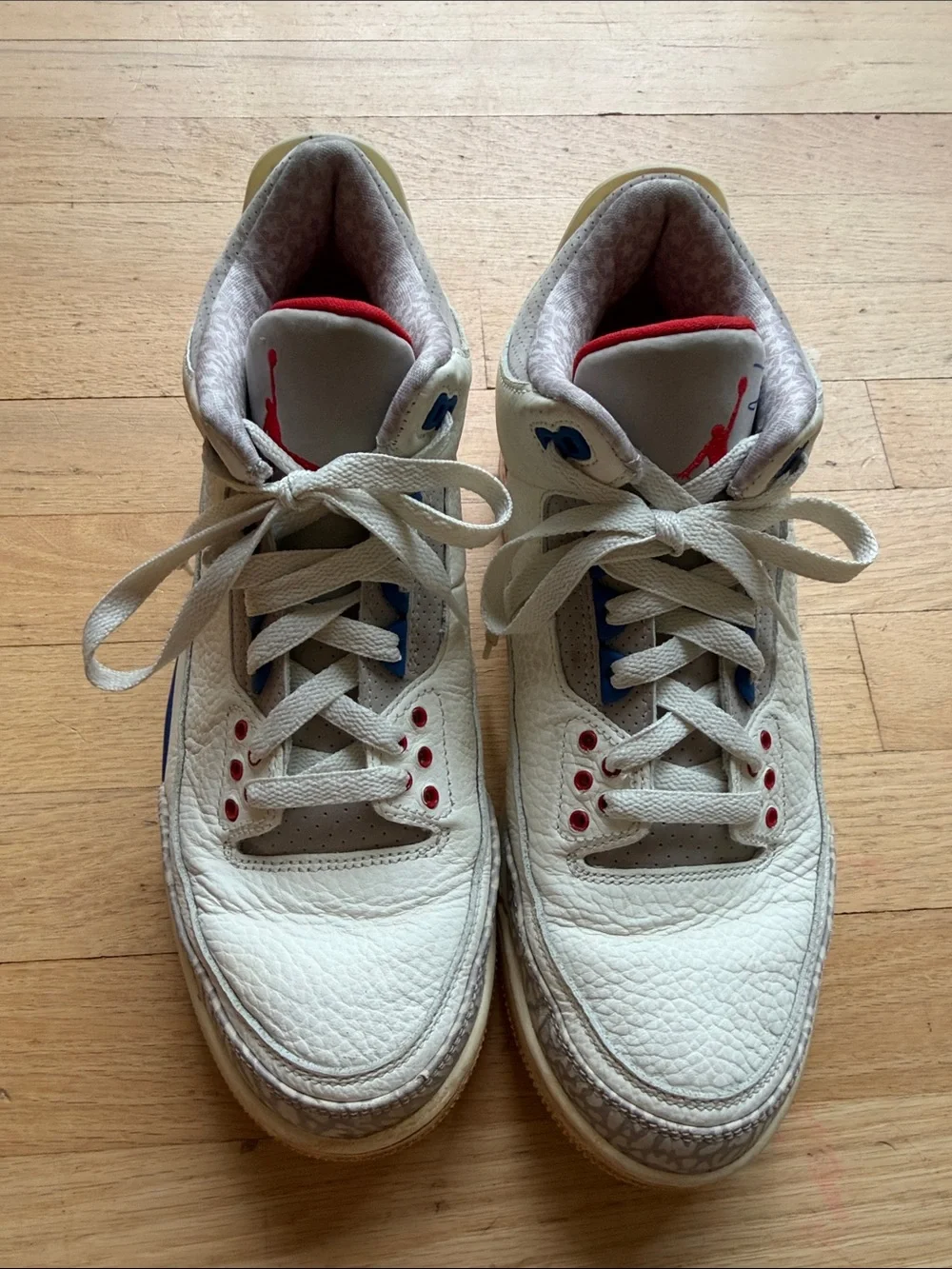 Nike White Sneakers with Blue & Red Accents